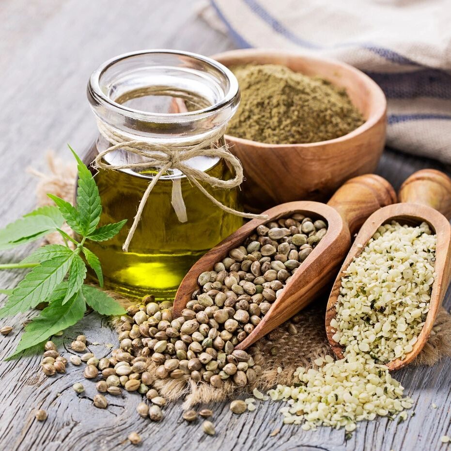 A table with some food and a jar of oil